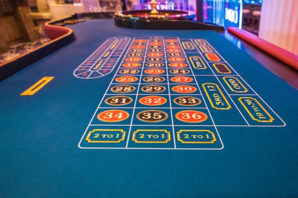 Casino Hold'em live dealer table with community cards and betting options displayed